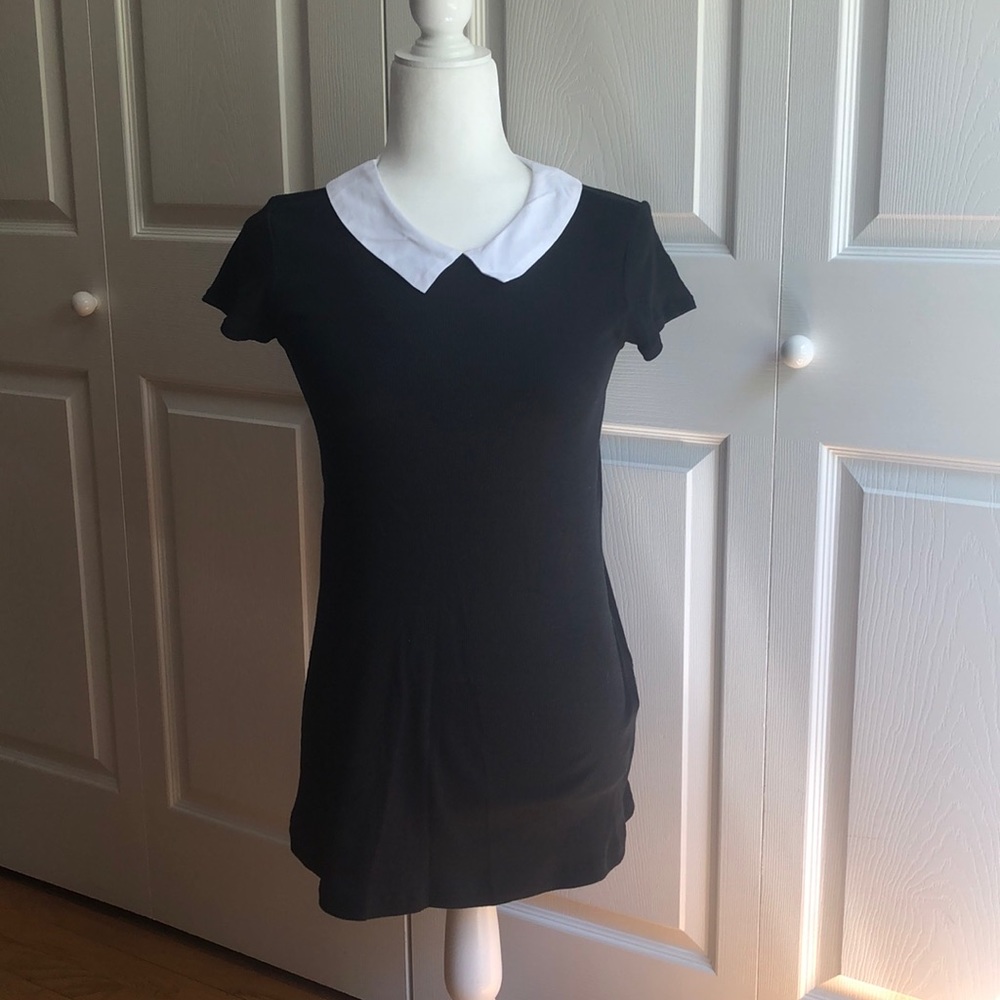 Black dress with Peterson collar.